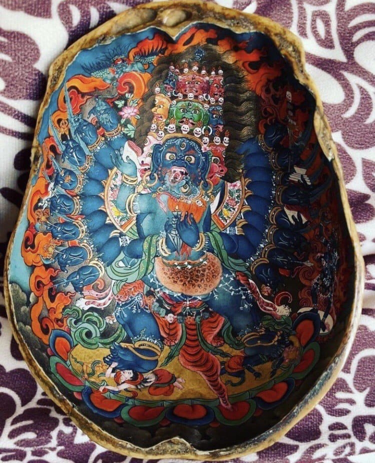 Hand-painted thangka on shell